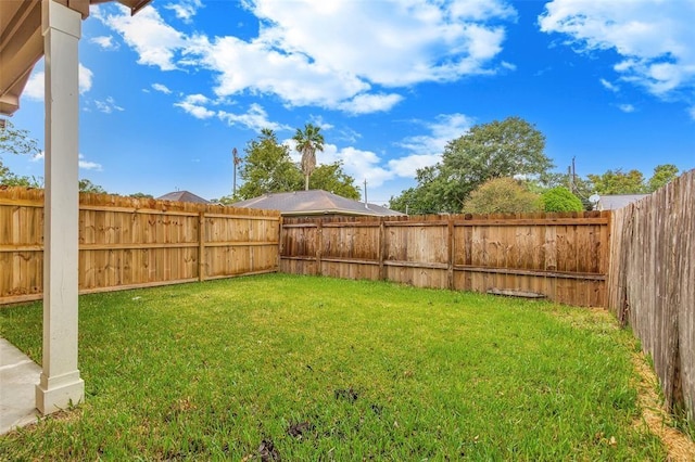 view of yard featuring a fenced backyard