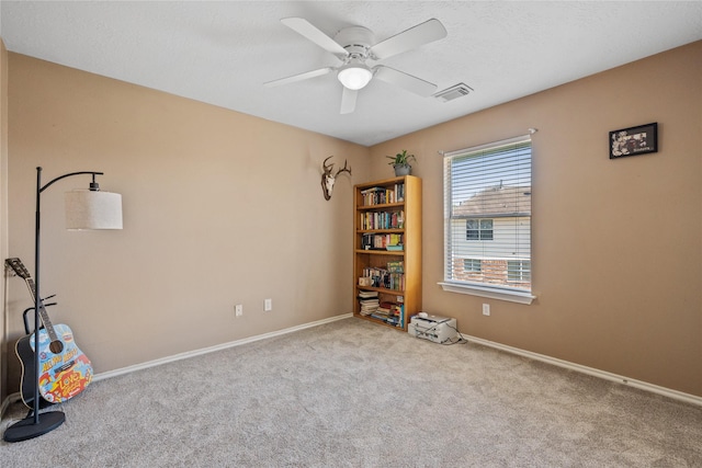 misc room featuring visible vents, baseboards, a ceiling fan, and carpet floors