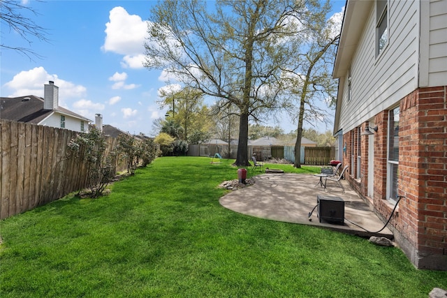 view of yard featuring a patio and a fenced backyard