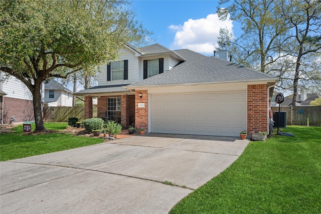 traditional-style house featuring brick siding, a front yard, and fence