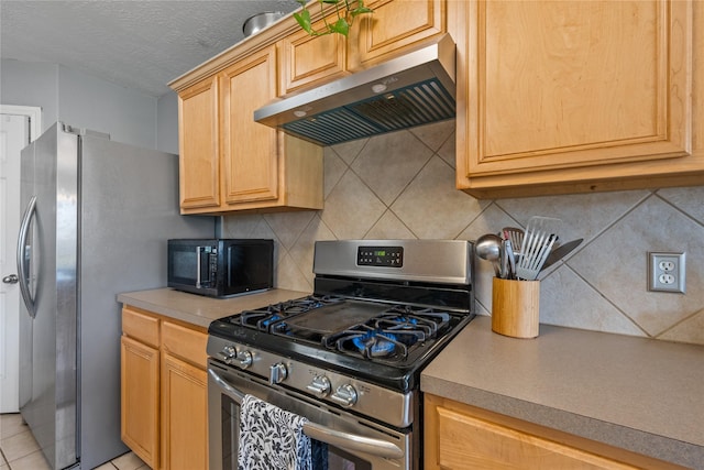 kitchen with backsplash, ventilation hood, light countertops, appliances with stainless steel finishes, and a textured ceiling