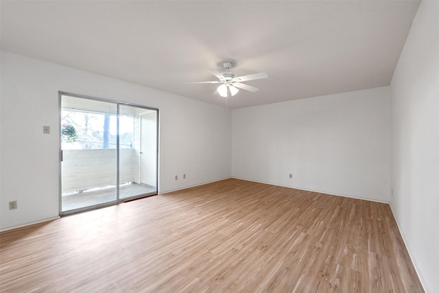 empty room featuring light wood-style floors and ceiling fan