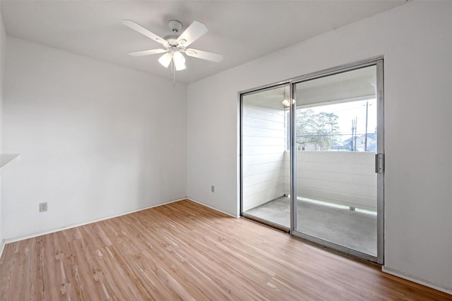 empty room with ceiling fan and wood finished floors