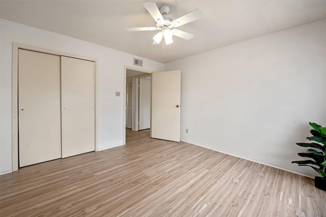 14515 Wunderlich Dr Unit 102, Houston, TX 77069 - unfurnished bedroom with light wood-style floors, a closet, and a ceiling fan