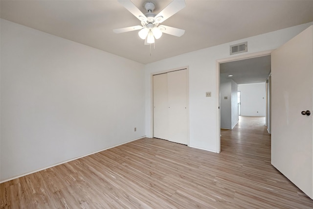 14515 Wunderlich Dr Unit 102, Houston, TX 77069 - unfurnished bedroom with light wood-style flooring, a closet, and ceiling fan