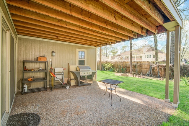 view of patio featuring area for grilling and fence