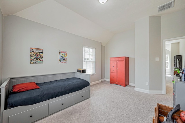 bedroom featuring vaulted ceiling, baseboards, visible vents, and carpet floors