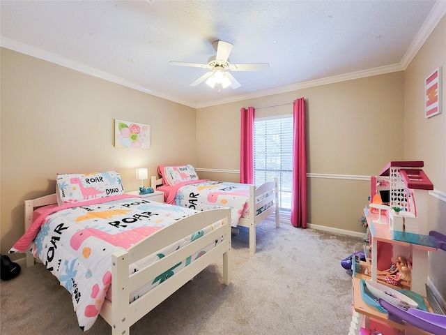 bedroom with crown molding, a ceiling fan, baseboards, and carpet floors