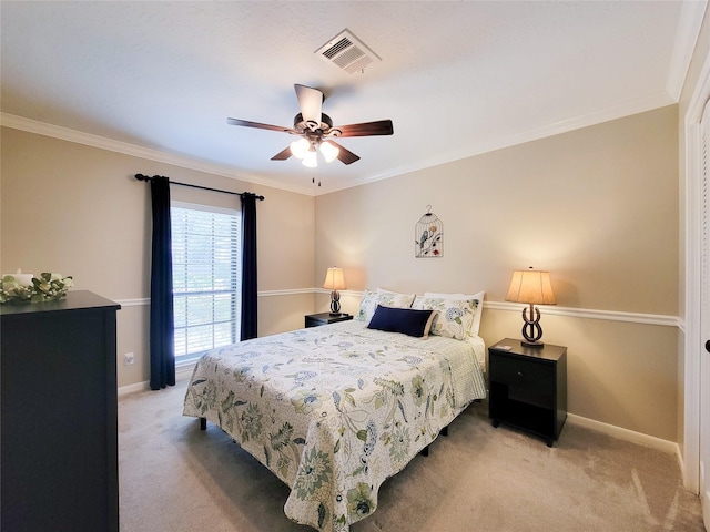 bedroom featuring visible vents, baseboards, carpet, and ornamental molding