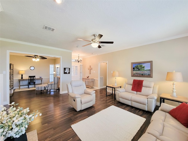 living area featuring visible vents, ornamental molding, ceiling fan with notable chandelier, dark wood-style floors, and a textured ceiling