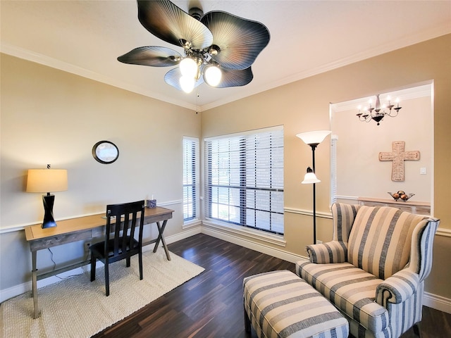 office area featuring ceiling fan with notable chandelier, crown molding, baseboards, and wood finished floors