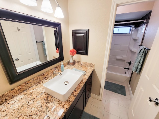 full bathroom featuring tile patterned flooring, vanity, tub / shower combination, and baseboards