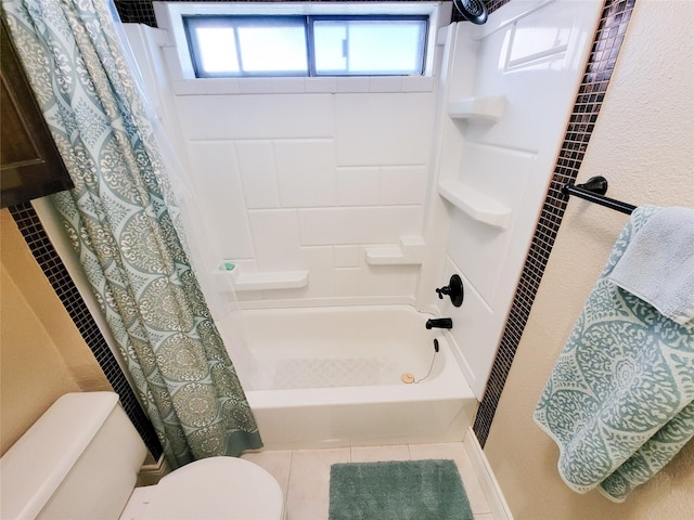 bathroom with tile patterned flooring, toilet, and shower / bath combo with shower curtain