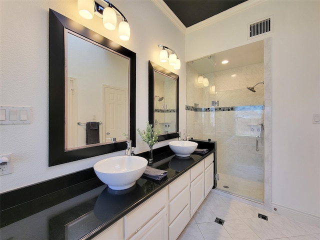 full bathroom with visible vents, ornamental molding, a shower stall, and a sink