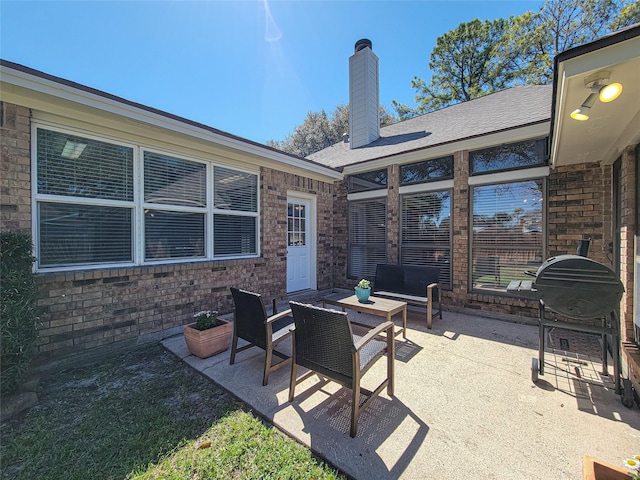 view of patio featuring an outdoor living space and a grill