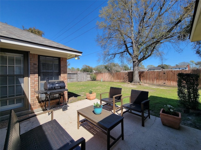 view of patio featuring a fenced backyard and grilling area