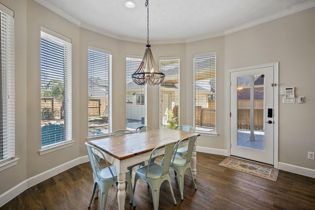 dining room with baseboards, dark wood-style floors, and ornamental molding