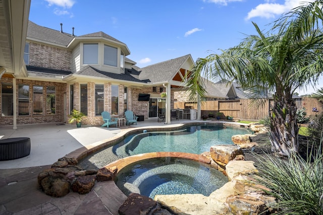 view of swimming pool featuring a patio area, a fenced in pool, an in ground hot tub, and fence