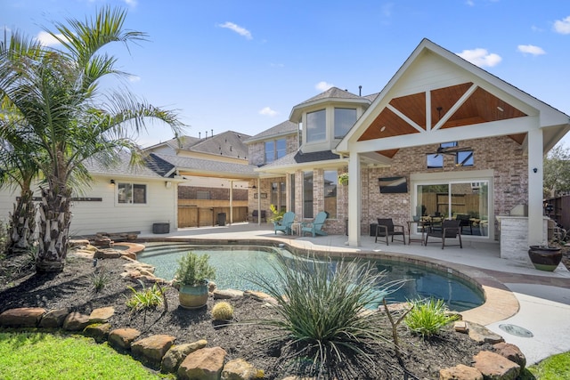 outdoor pool with a patio and fence