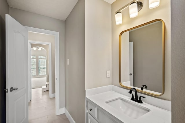 bathroom featuring vanity and baseboards