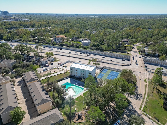 birds eye view of property with a wooded view