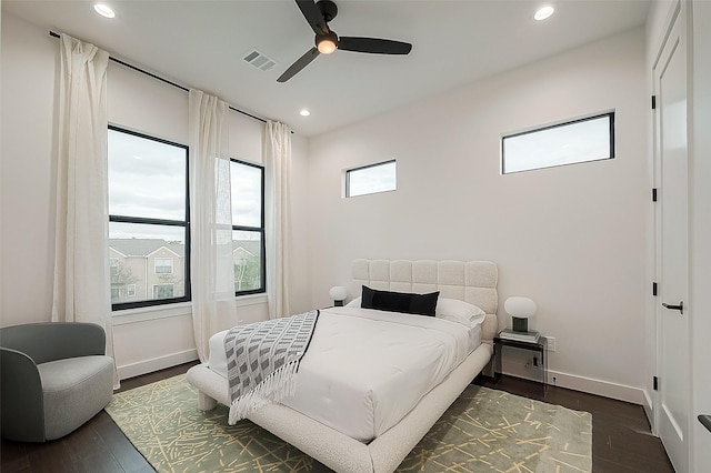 bedroom with recessed lighting, visible vents, baseboards, and dark wood-style flooring