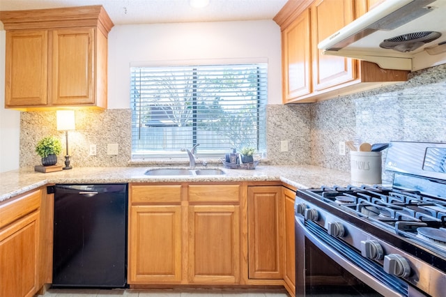 kitchen featuring tasteful backsplash, under cabinet range hood, dishwasher, gas stove, and a sink