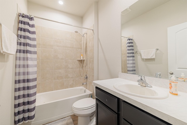 bathroom featuring vanity, toilet, and shower / tub combo