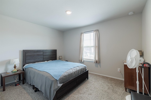 bedroom featuring baseboards and carpet floors