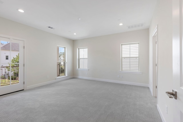 spare room with visible vents and baseboards