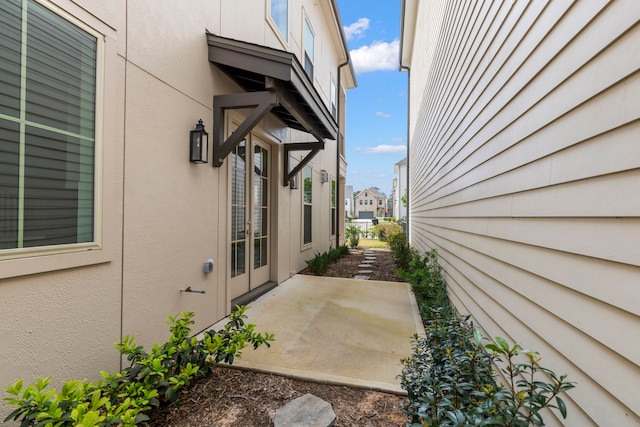 view of side of property featuring a patio