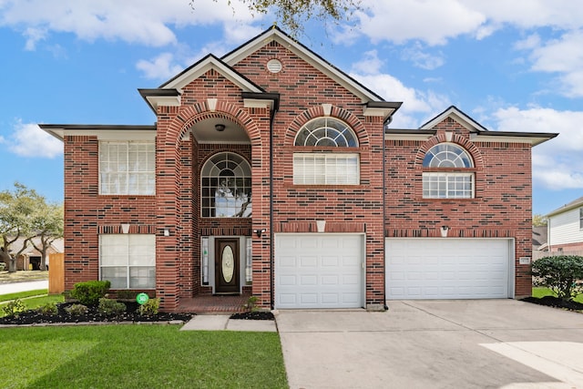 traditional-style house featuring a garage, brick siding, concrete driveway, and a front lawn