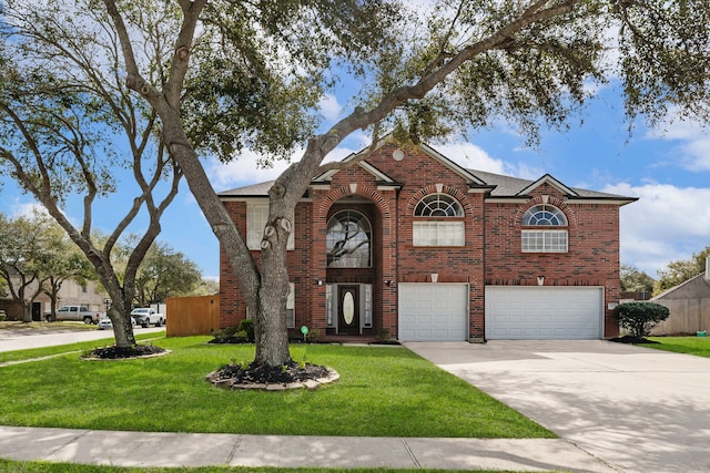 traditional home with a front yard, brick siding, concrete driveway, and an attached garage