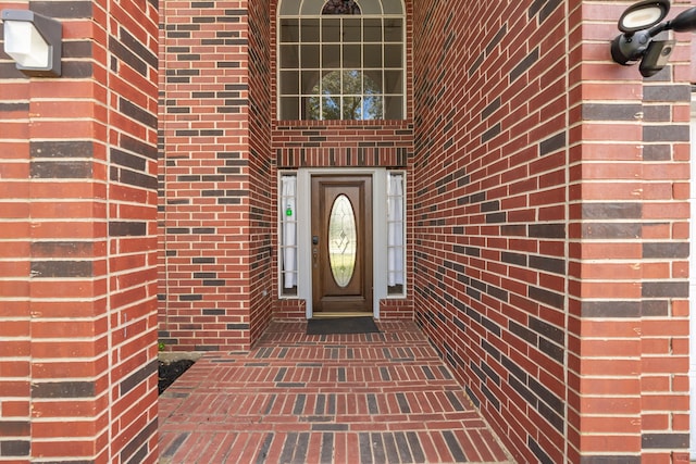 property entrance with brick siding