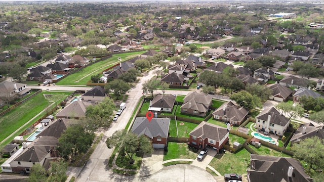 birds eye view of property with a residential view