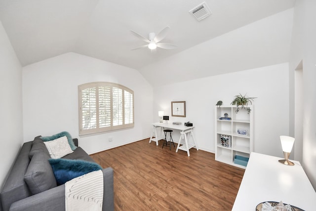 home office featuring ceiling fan, visible vents, wood finished floors, and vaulted ceiling