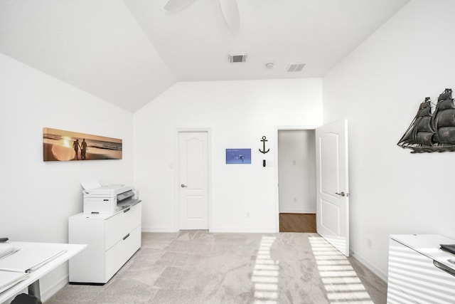 bedroom with light carpet, visible vents, baseboards, and vaulted ceiling