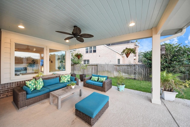 view of patio featuring an outdoor living space, a fenced backyard, and ceiling fan