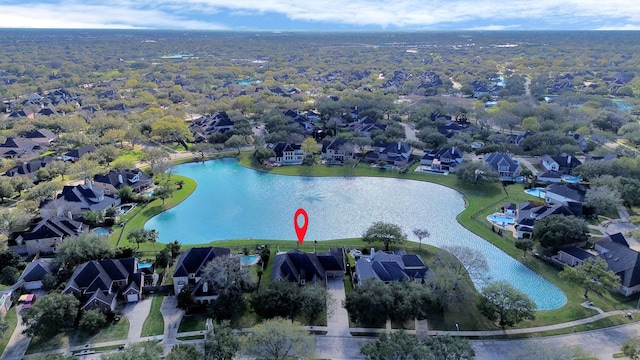 bird's eye view with a residential view and a water view