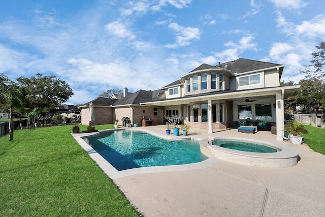 rear view of house with a yard, a patio area, a fenced backyard, and ceiling fan