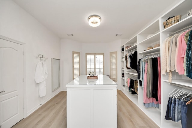 walk in closet with visible vents and light wood-type flooring