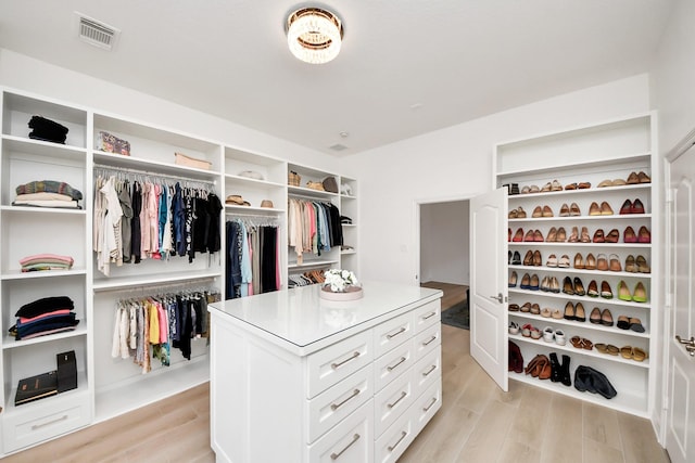 spacious closet with light wood finished floors and visible vents