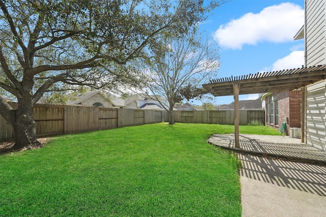 view of yard featuring a patio, a fenced backyard, and a pergola