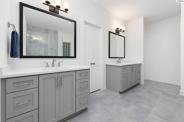1239 W 23rd St Unit A, Houston, TX 77008 - bathroom with two vanities, baseboards, and a tile shower