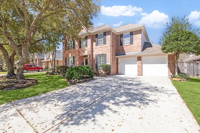 view of front of house with brick siding, concrete driveway, and a front lawn