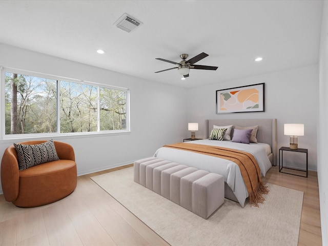 bedroom featuring visible vents, wood finished floors, recessed lighting, baseboards, and ceiling fan