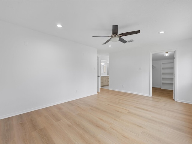 spare room featuring visible vents, baseboards, ceiling fan, light wood-type flooring, and recessed lighting