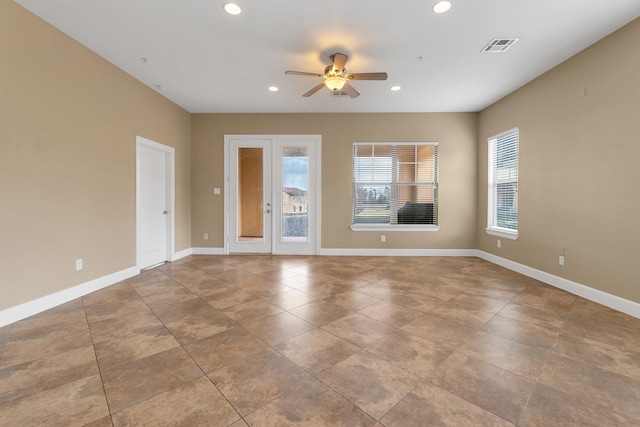 tiled spare room with visible vents, recessed lighting, and baseboards