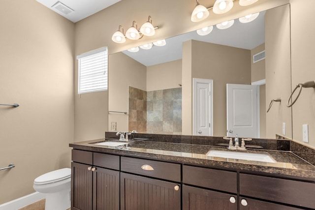 full bathroom with visible vents, toilet, and a sink