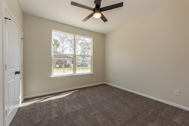 unfurnished bedroom with carpet flooring, a ceiling fan, and baseboards